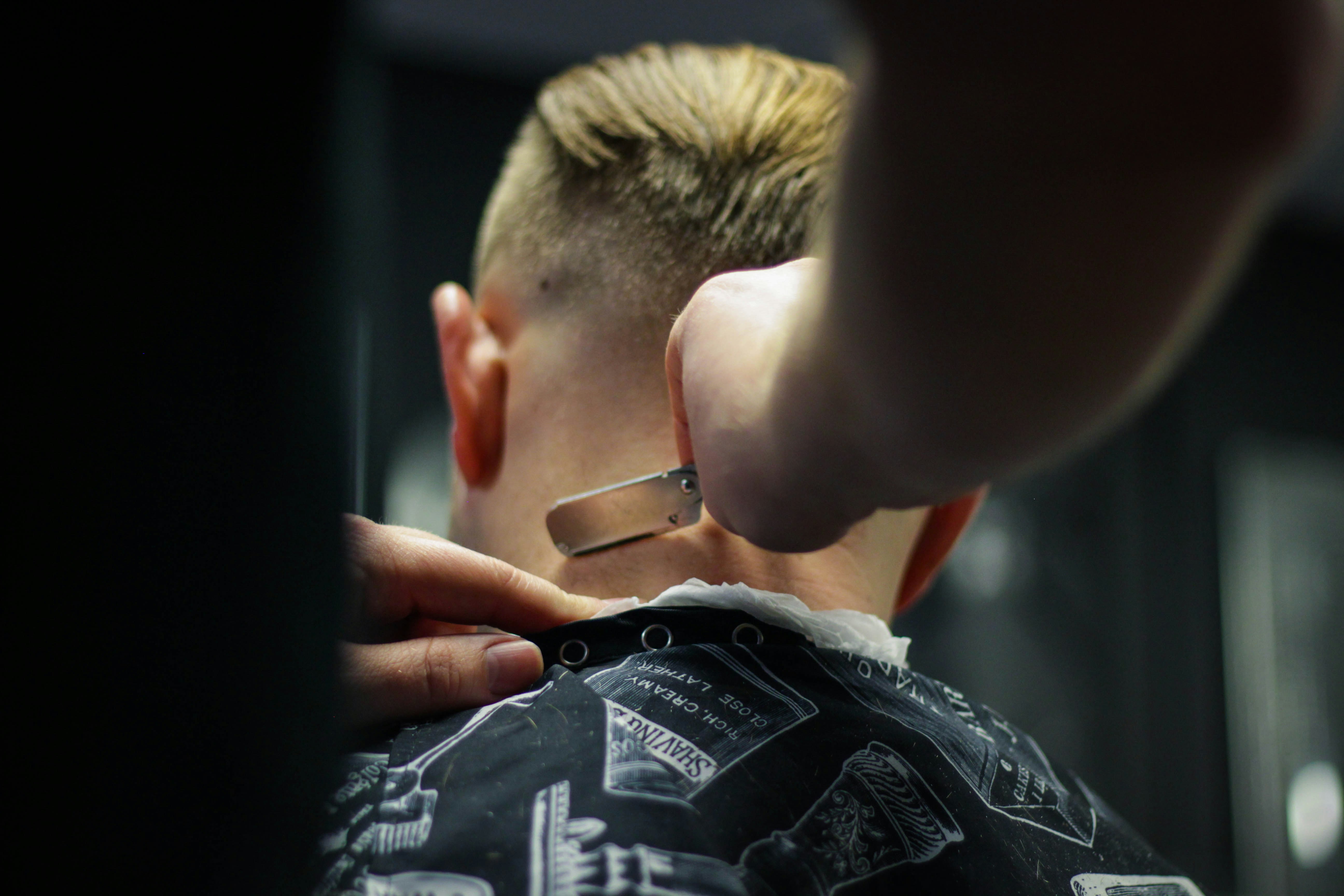 A barber at work behind the chair